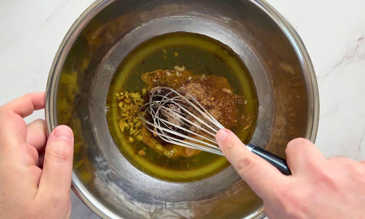 Mixing the marinade in a bowl.