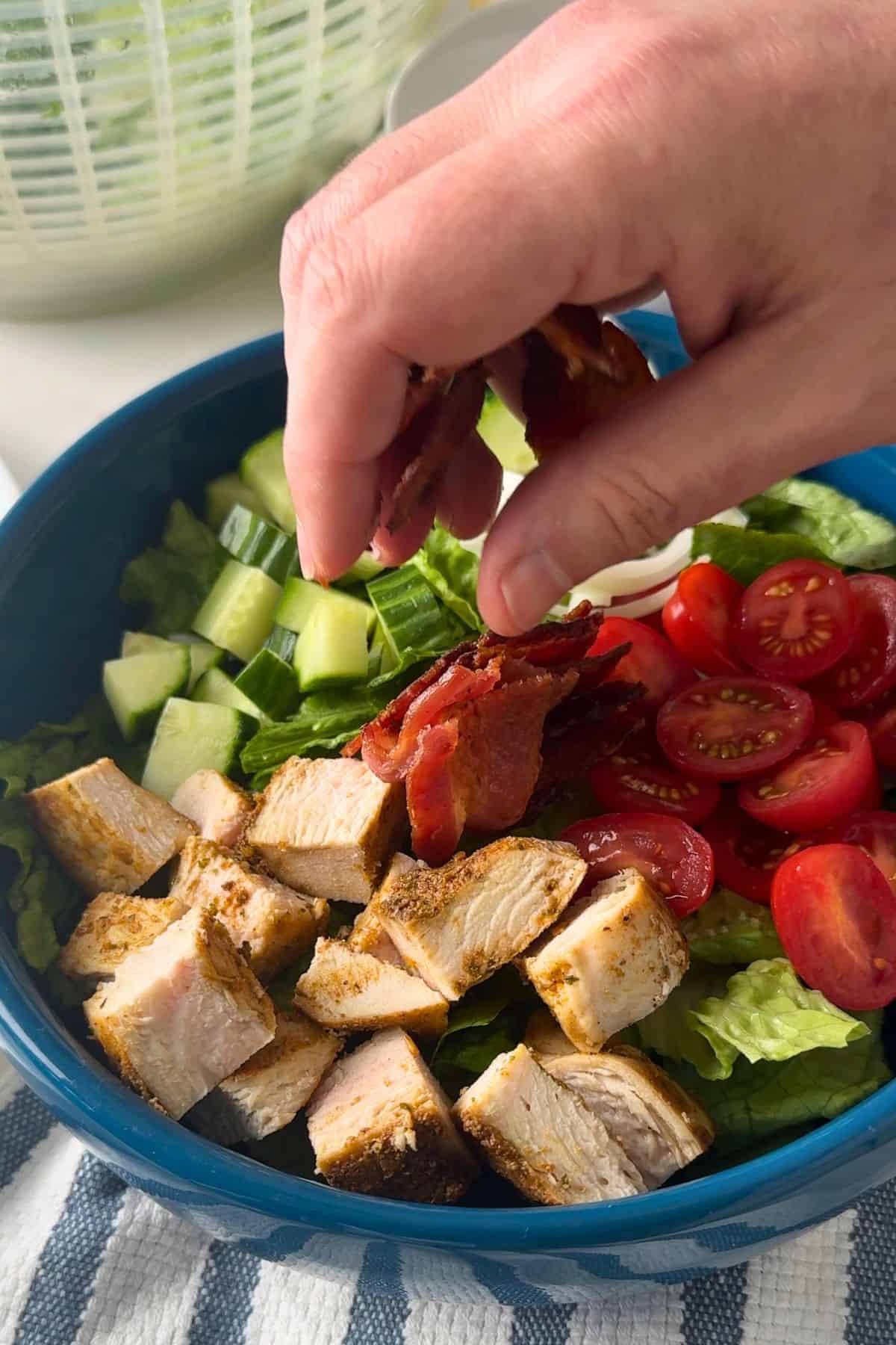 Assembling the salad.