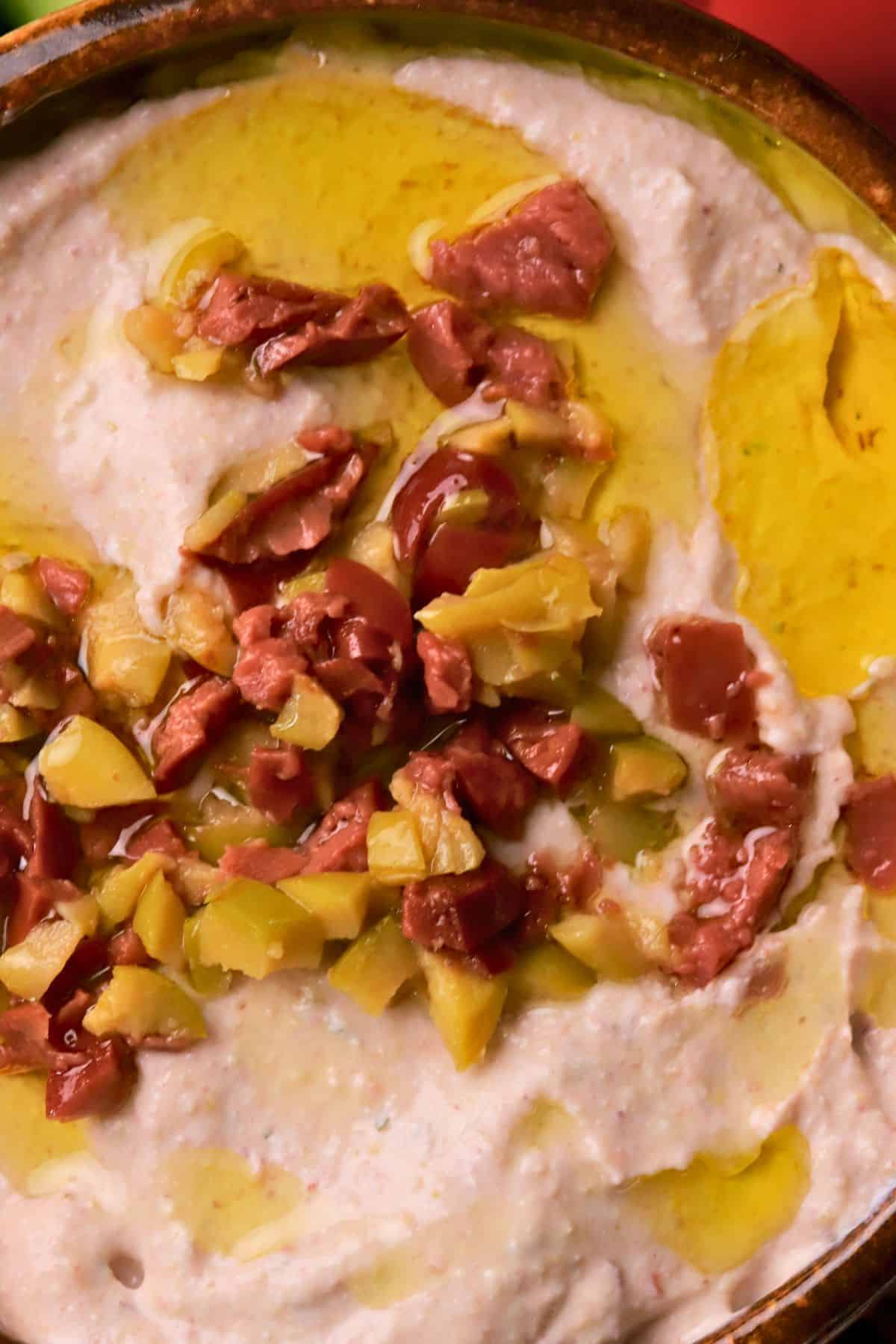 Closeup of the low carb olive cottage cheese dip in a bowl.