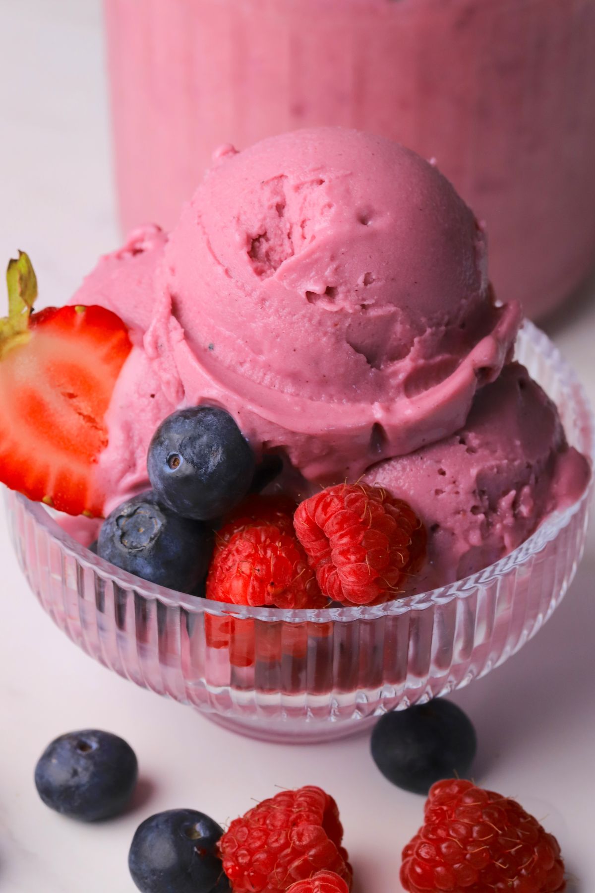 Ninja creami low carb triple berry ice cream in a bowl with fresh berries.