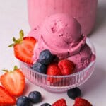 Ninja creami low carb triple berry ice cream in a bowl with fresh berries.