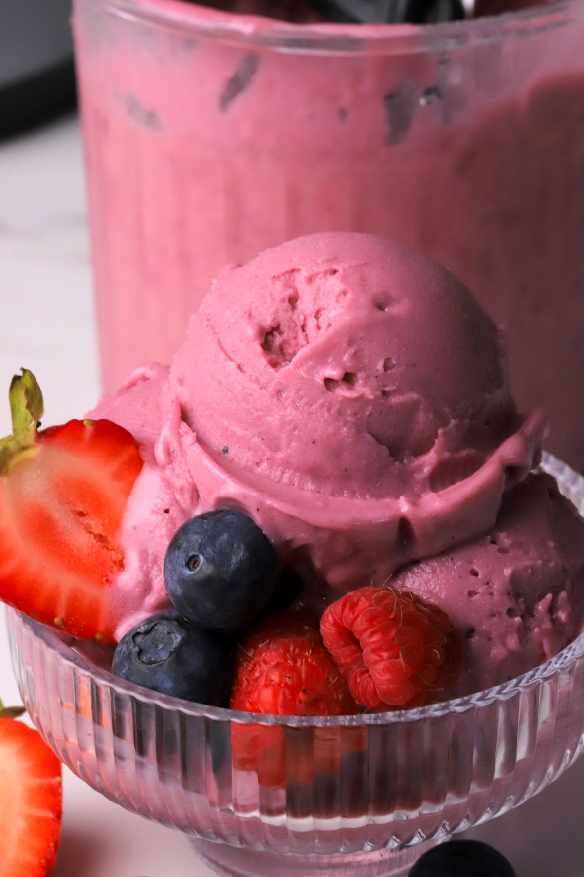 Ninja creami low carb triple berry ice cream in a bowl with fresh berries.