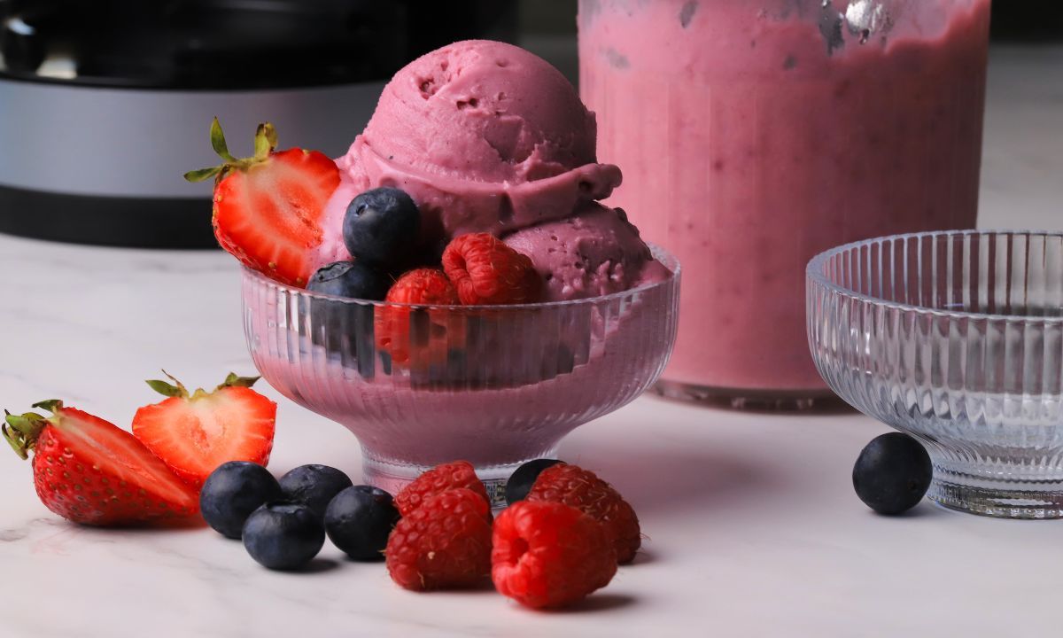 Ninja creami low carb triple berry ice cream in a bowl with fresh berries.