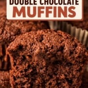 Close up of a low carb double chocolate muffin stacked on top of other muffins.