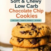 Low carb chocolate chip cookies stacked on top of each other next to a glass of milk.