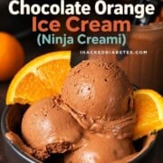 Scoops of low carb chocolate orange ninja creami ice cream in a bowl with orange segments.