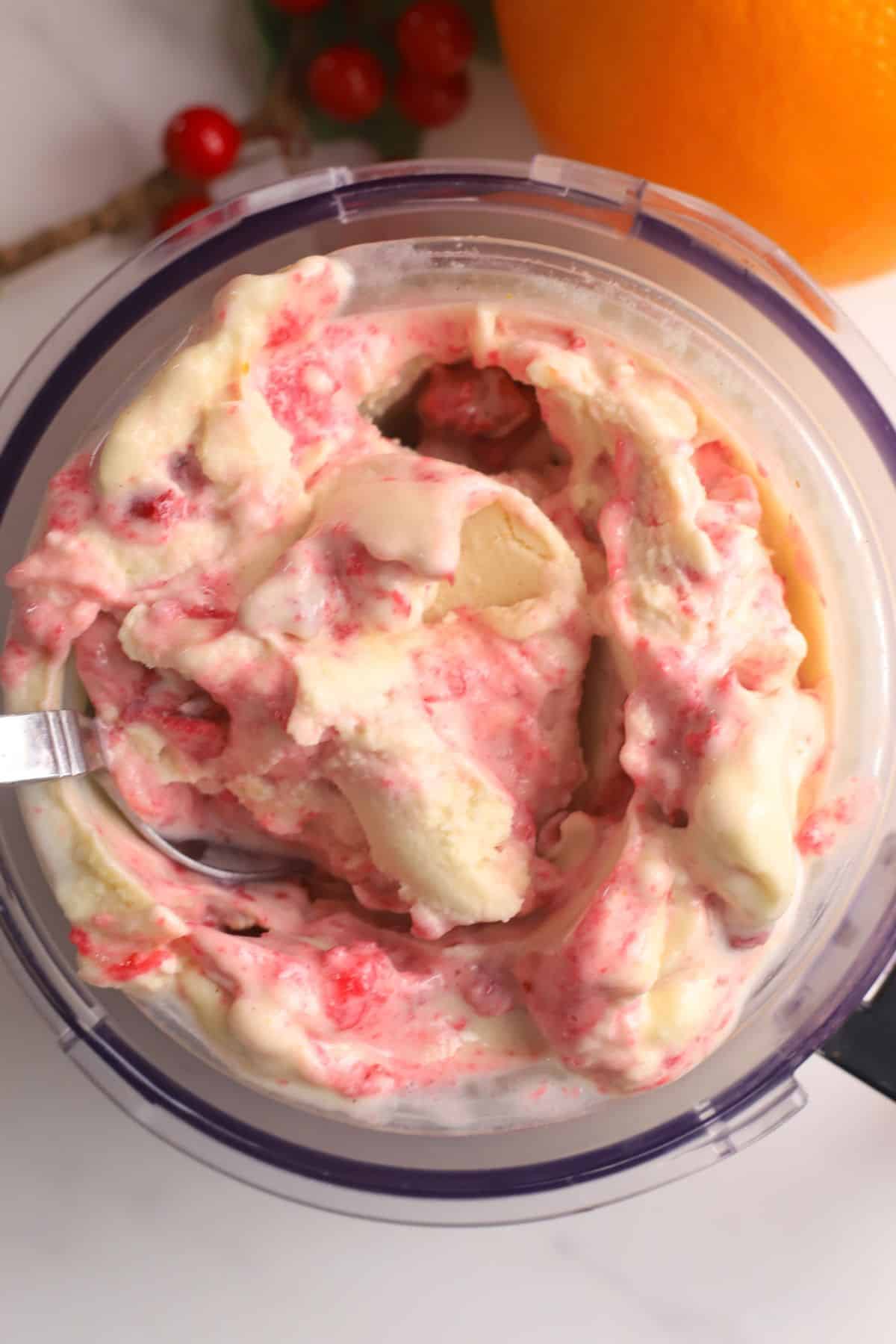Cranberry orange spice ice cream in a ninja creami pint.