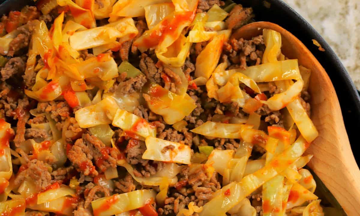 Wide shot of the low carb dirty cabbage in a skillet.