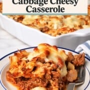 A slice of the low carb italian beef and cabbage cheesy casserole on a plate next to the casserole dish.